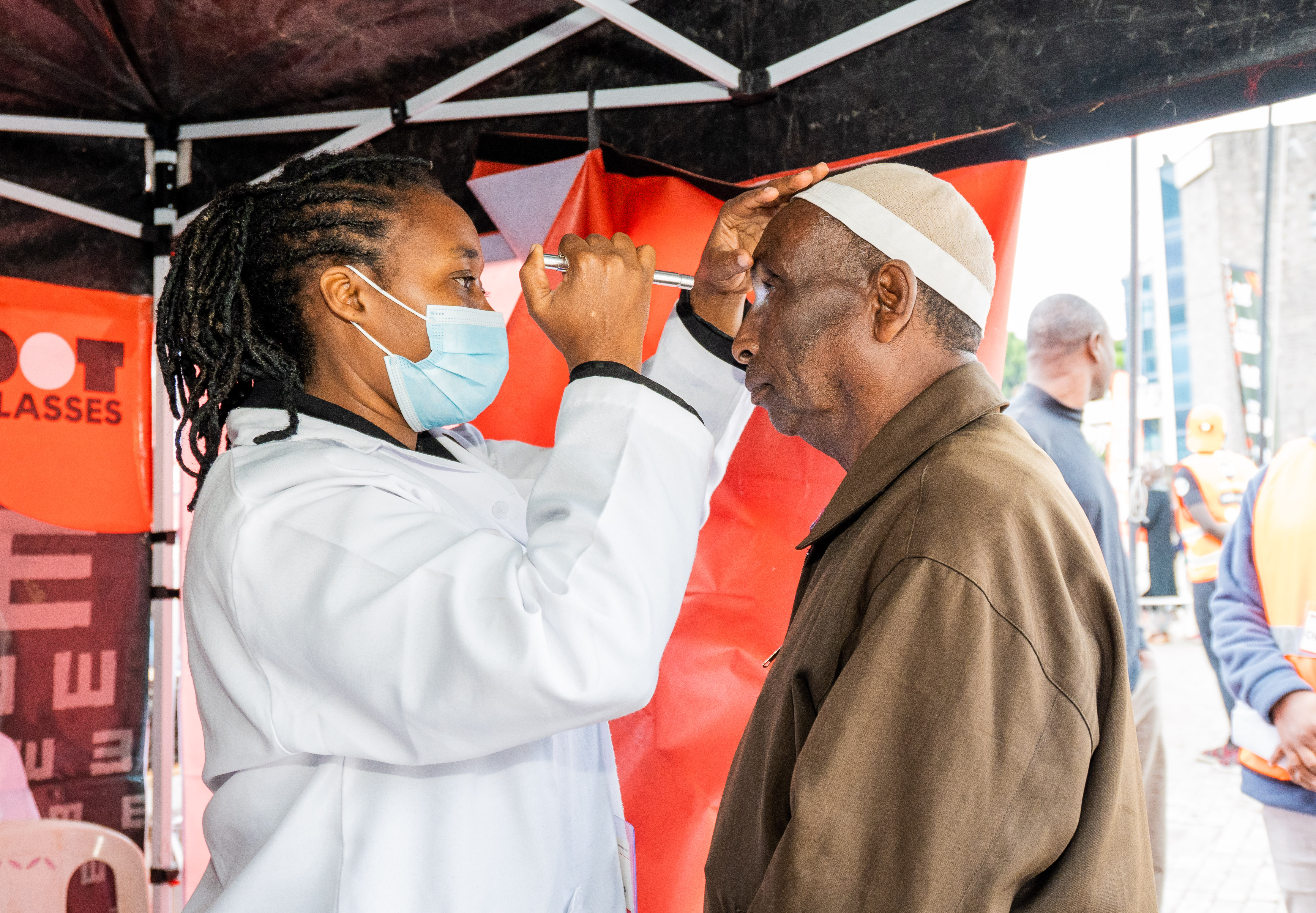 Participant undergoing visual screening in a Kenyan field setting